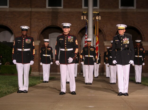 Sergeant Maj. Ronald L. Green, 18th Sergeant Major the Marine Corps, left, Sergeant Maj. Troy E. Black, 19th Sergeant Major of the Marine Corps, middle, and Commandant of the Marine Corps Gen. David H. Berger, right, stand in the reviewing area at the conclusion of a relief and appointment ceremony at Marine Barracks Washington, D.C., July 26, 2019. The emblematic passing of the sword of office signifies the transfer of the senior enlisted leader of Marines and advisor to the commandant from 18th Sergeant Major of the Marine Corps Sgt. Maj. Ronald L. Green to Sgt. Maj. Black.