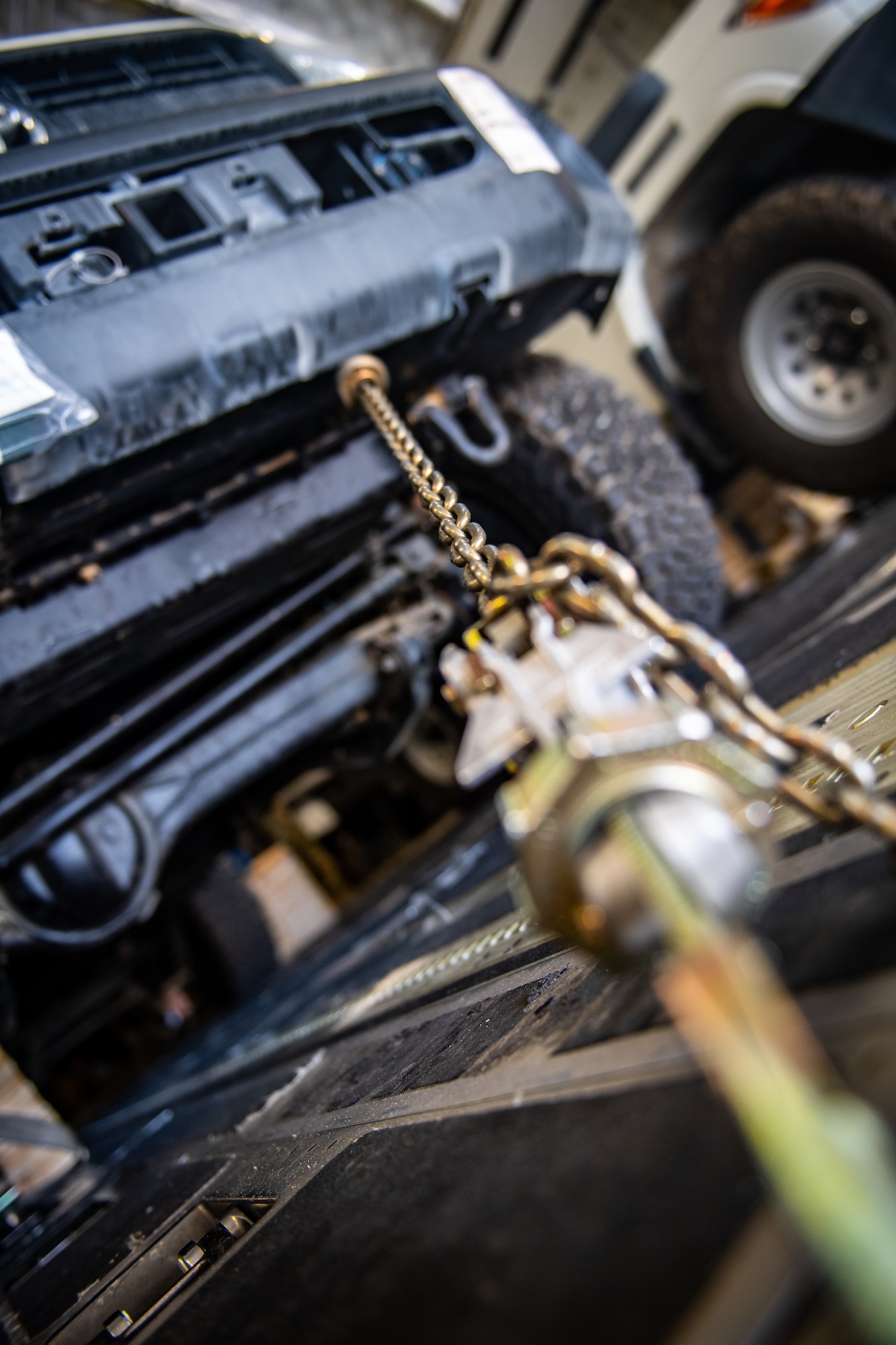 Chains used to secure cargo inside a U.S. Air Force C-17 Globemaster III during flight are disconnected prior to unloading in Jordan, Oct. 14, 2019. The port provides aerial logistics for the American Embassy to Jordan through the Military Assistance Program, handling cargo and passenger movement in support of State Department efforts.