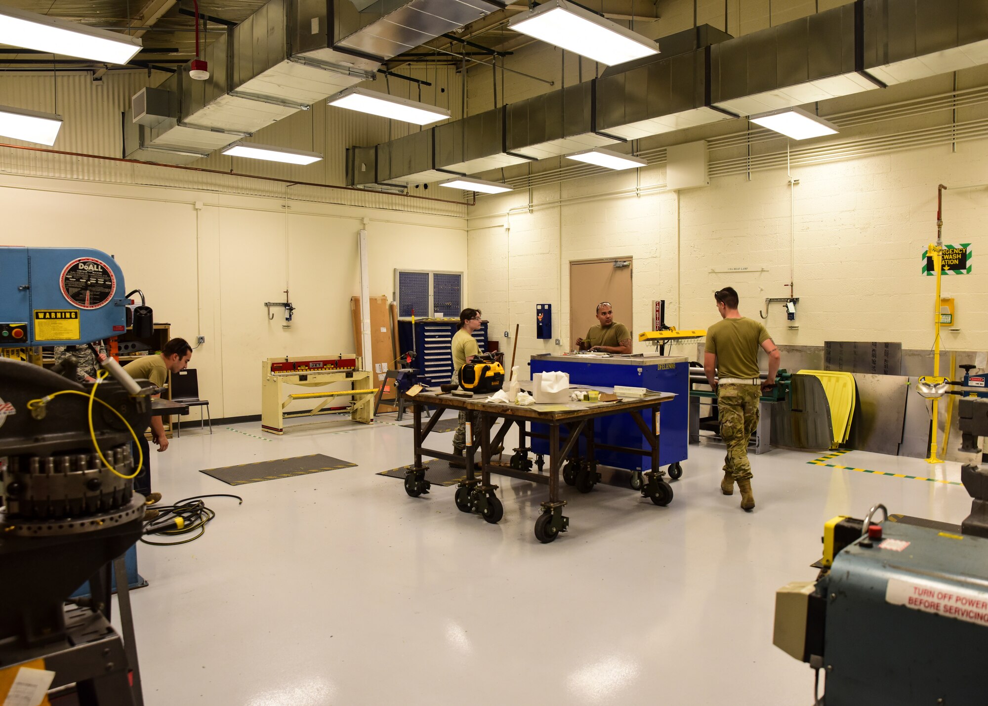 Airmen work in 355th EMS ISO Sheet Metal Shop