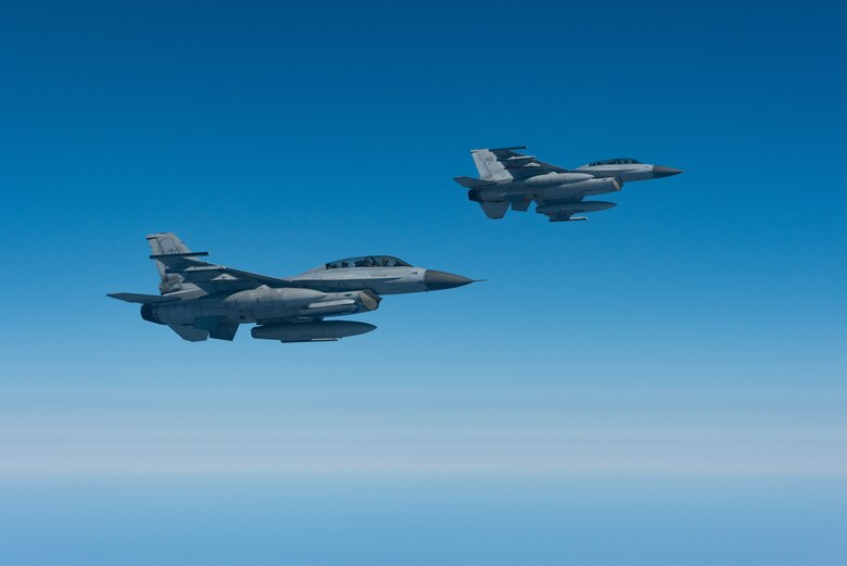 Two Republic of Korea Air Force F-16D Fighting Falcons fly during a training exercise Oct. 8, 2019. The 909th Air Refueling Squadron from Kadena Air Base trains with ROKAF periodically to enhance readiness and joint force lethality. Both the United States and Republic of Korea continue to develop interoperability through the use of annual joint and combined exercises such as Ulchi Freedom Guardian, Key Resolve, and Foal Eagle. (U.S. Air Force photo by Senior Airman Cynthia Belío)