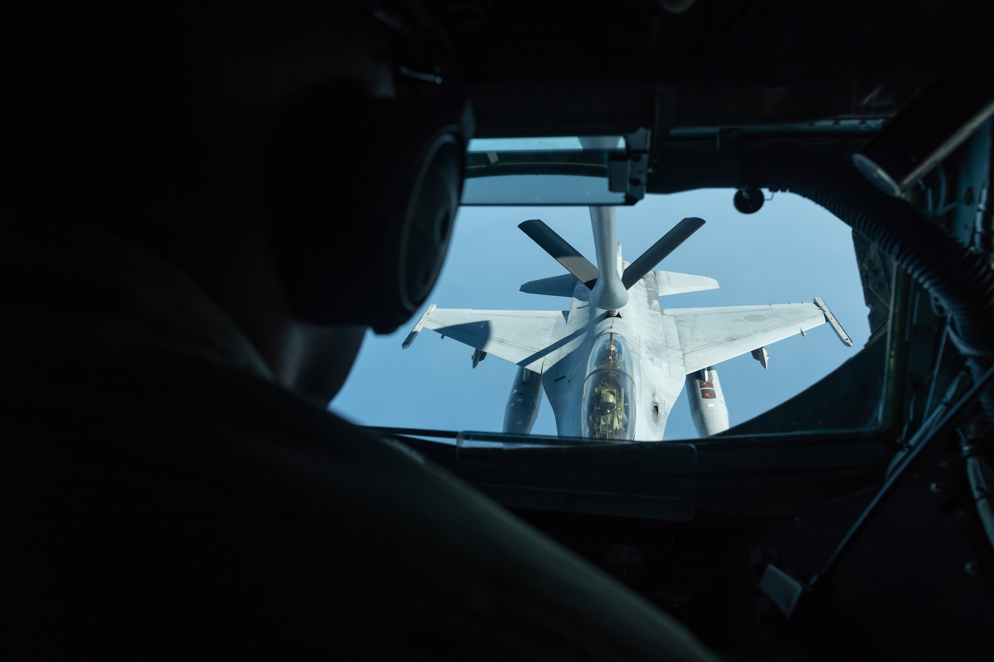 U.S. Air Force Staff Sgt. James Walker, 909th Air Refueling Squadron boom operator, performs refuel training with a Republic of Korea Air Force F-16D Falcon during a training exercise Oct. 8, 2019. The 909th ARS helps ensure a free-and-open Indo-Pacific by providing air refueling to U.S., allies and partners within the area of responsibility. The 909th trained with Republic of Korea Air Force F-16D Falcons as part an ongoing military alliance. The U.S.-ROK partnership is increasingly global in nature and our countries are partners on a broad range of security, development and economic initiatives around the world. (U.S. Air Force photo by Senior Airman Matthew Seefeldt)