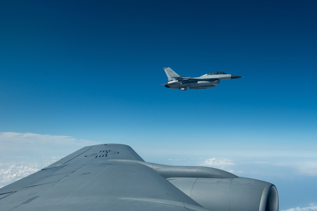 A Republic of Korea Air Force F-16D Falcon flies in formation with a KC-135 Stratotanker from the 909th Air Refueling Squadron, Kadena Air Base, Japan, during a training exercise Oct. 8, 2019. The 909th ARS supports the execution of tactical, conventional, and peacetime operations as directed by the President, Secretary of Defense, and higher headquarters. The U.S.-ROK partnership in the region brings together bilateral and multilateral security relationships to preserve a free-and-open Indo-Pacific. (U.S. Air Force photo by Senior Airman Matthew Seefeldt)