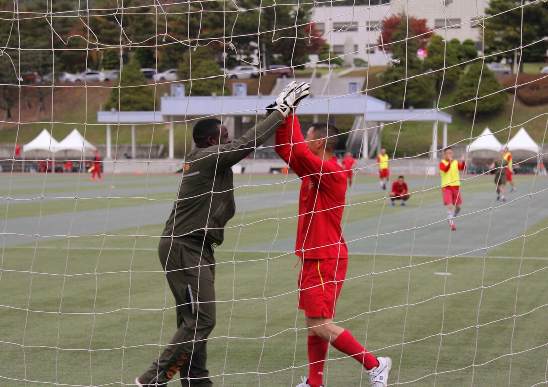 U.S. and Republic of Korea Marines celebrate during a field meet involving multiple games and competitions and an awards ceremony here, October 23. The Marines competed in multiple games and competitions including soccer, dodge ball, a three legged race, and a 1200 meter relay race. The field meet enhanced the ROK-U.S. Alliance and strengthened the relationship between the two countries’ Marine Forces. (Official U.S. Marine Corps photos by Sgt. Parker Golz)