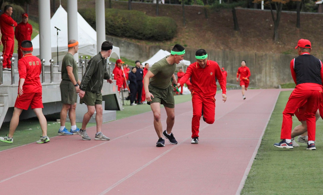 U.S. and Republic of Korea Marines compete in a 1200 meter relay race at a field meet here, October 23. The Marines competed in multiple games and competitions including soccer, dodge ball, a three legged race, and a 1200 meter relay race. The field meet enhanced the ROK-U.S. Alliance and strengthened the relationship between the two countries’ Marine Forces. (Official U.S. Marine Corps photos by Sgt. Parker Golz)