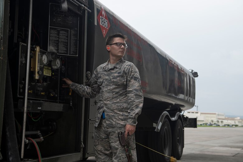 U.S. Air Force Senior Airman Dylan Heaton, 18th Logistics Readiness Squadron fuels distribution operator, controls the refueling of an F-15C Eagle from an R-11 Refueler at Kadena Air Base, Japan, Sept. 18, 2019. The 18th LRS petroleum, oil and lubricants flight supports all home station and transient aircraft, managing 1.3M gallons of fuel annually for 320 organizations. (U.S. Air Force photo by Tech. Sgt. Matthew B. Fredericks)