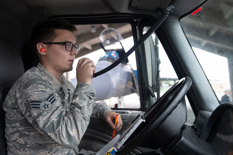 U.S. Air Force Senior Airman Dylan Heaton, 18th Logistics Readiness Squadron fuels distribution operator, coordinates with the fuels service center after refueling an F-15C Eagle at Kadena Air Base, Japan, Sept. 18, 2019. The 18th LRS petroleum, oil and lubricants flight supports all home station and transient aircraft, managing 1.3M gallons of fuel annually for 320 organizations. (U.S. Air Force photo by Tech. Sgt. Matthew B. Fredericks)