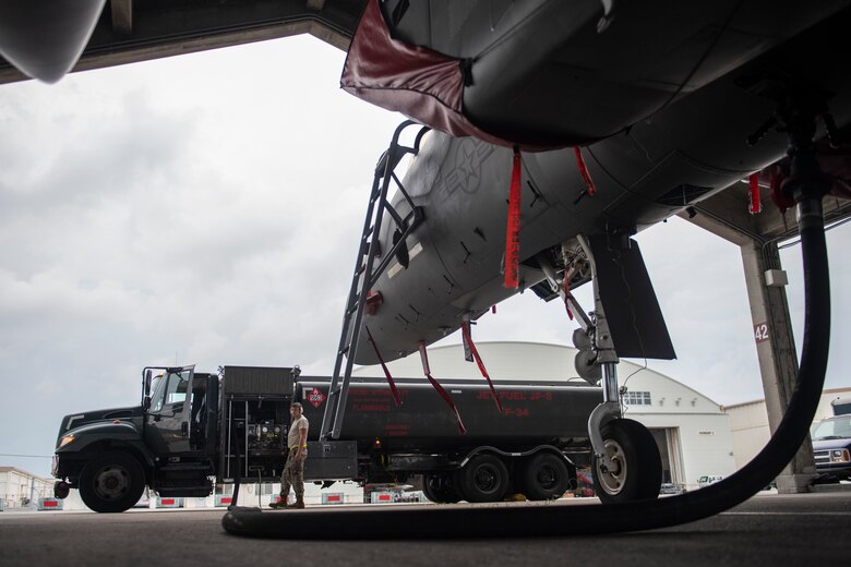 U.S. Air Force Airman 1st Class Auggie Toppo, 18th Logistics Readiness Squadron fuels distribution operator, controls the refueling of an F-15C Eagle from an R-11 Refueler at Kadena Air Base, Japan, Sept. 18, 2019. The 18th LRS petroleum, oil and lubricants flight supports all home station and transient aircraft, managing 1.3M gallons of fuel annually for 320 organizations. (U.S. Air Force photo by Tech. Sgt. Matthew B. Fredericks)