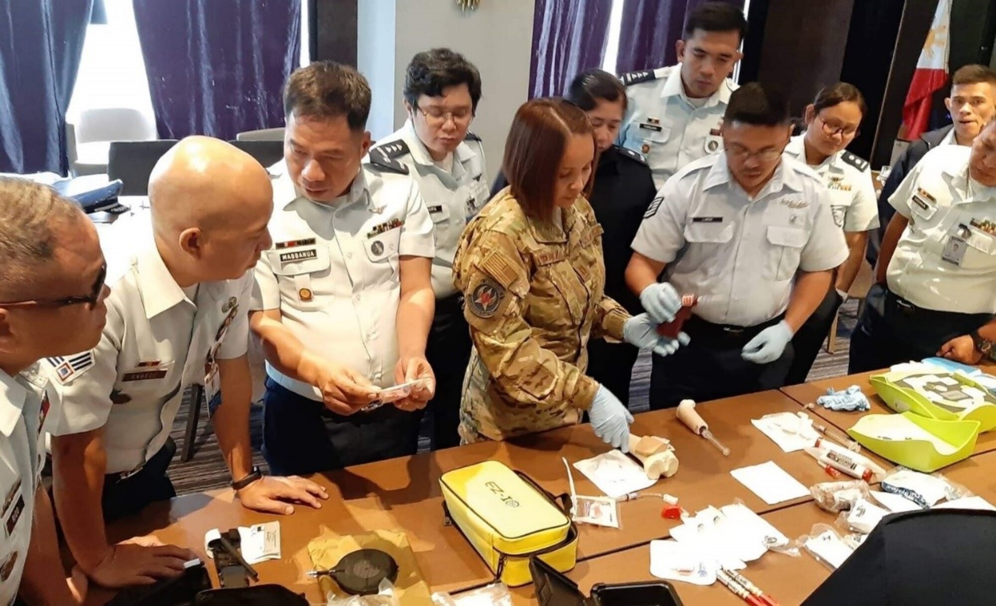 U.S. Pacific Air Force Capt. Stefhanie Jimenez, aeromedical evacuation nurse, demonstrates intraosseous intravenous insertion to Philippine air force medical personnel, Clark Air Base, Philippines, September 11, 2019. (Courtesy photo)