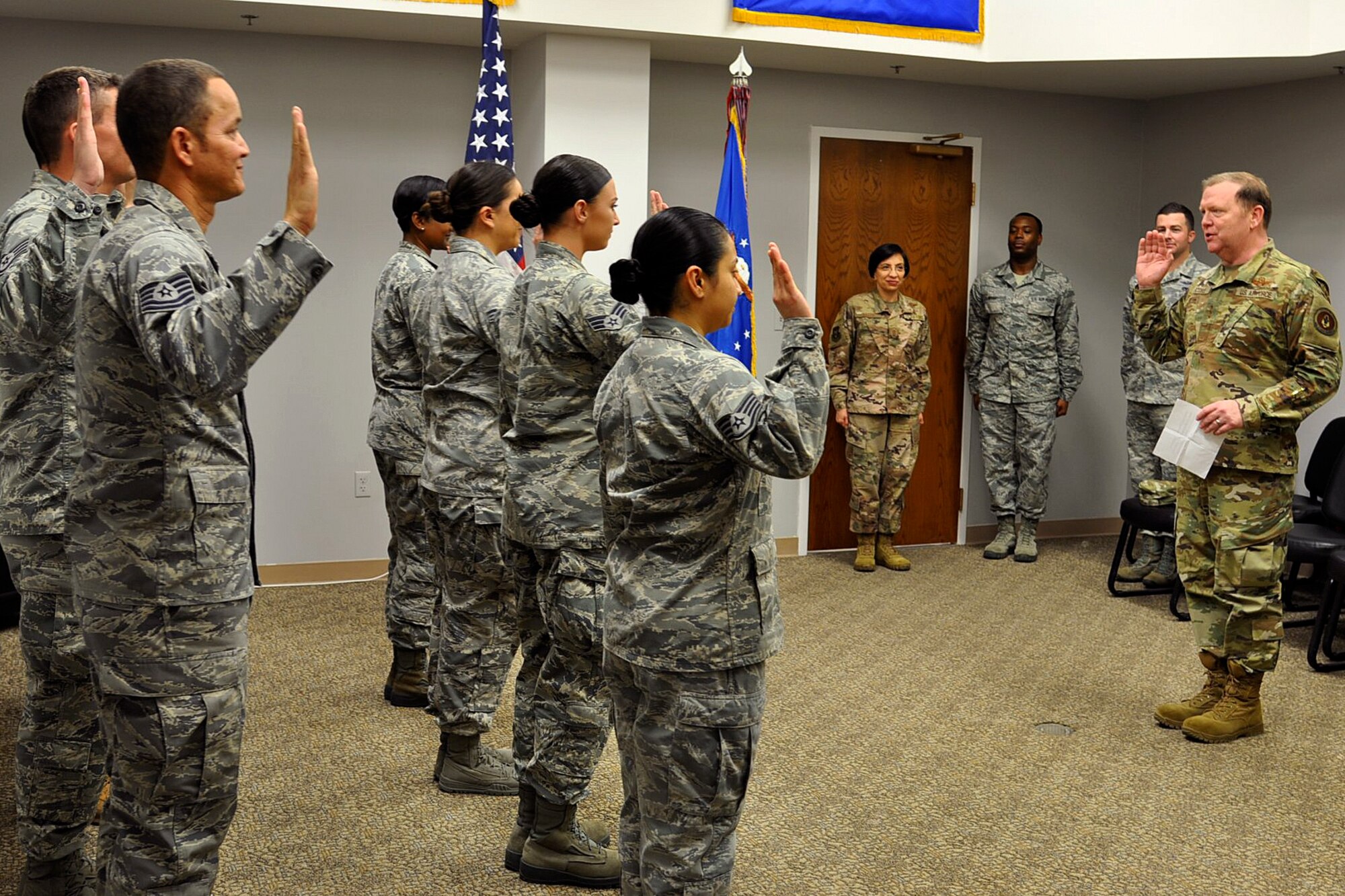 Lt. Gen. Richard W. Scobee, Commander, Air Force Reserve Command, administers the Oath of Enlistment to Airmen attached to the 940th Airlift Wing, Beale Air Force Base, California, for a re-enlistment ceremony during the January Unit Training Assembly of 2019, Beale Air Force Base, California. (Courtesy photo)