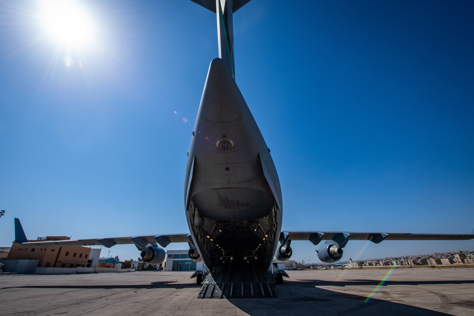 A U.S. Air Force C-17 Globemaster III awaits cargo off-load after landing in Jordan, Oct. 14, 2019. The port provides aerial logistics for the American Embassy to Jordan through the Military Assistance Program, handling cargo and passenger movement in support of State Department efforts.