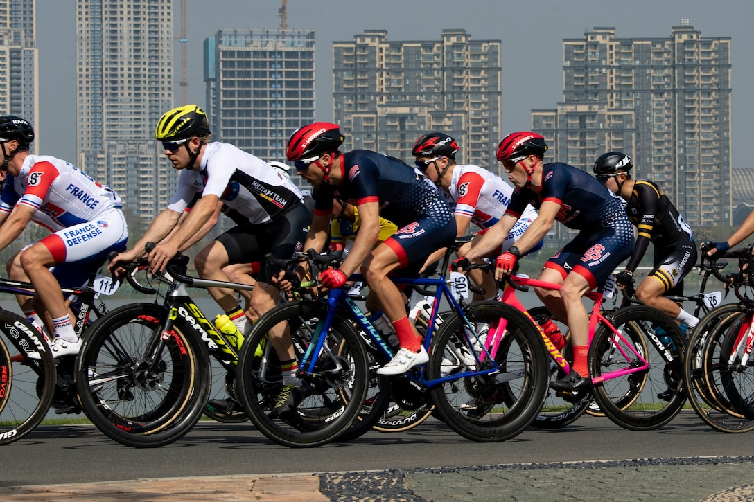 Closely packed bicyclists compete in an 80-mile race.