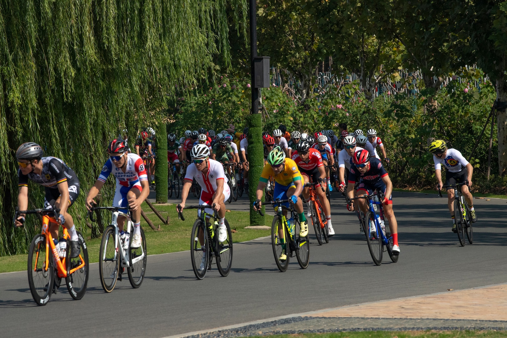 Bicyclists turn a corner during an 80-mile race.