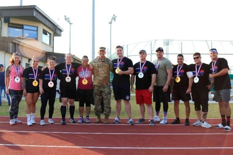 Gina Petrino (far left), a U.S. Army Corps of Engineers, Far East District contract specialist, after she won 2nd place for her weight class at  the 2019 U.S. Army Garrison Humphreys Strongest Warrior competition, at Balboni Field, Camp Humphreys, South Korea, Oct. 19.