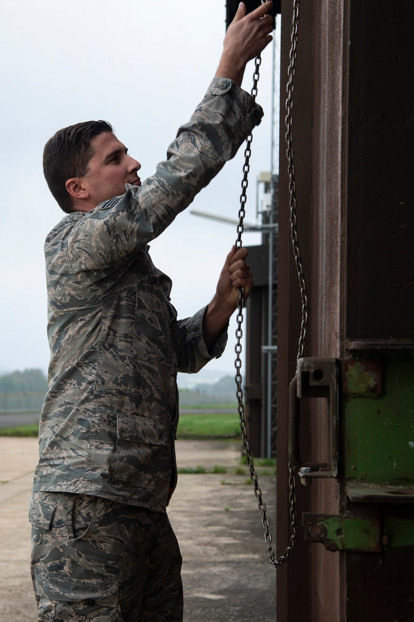 U.S. Air Force Senior Airman Matthew Tortorice, 52nd Maintenance Squadron munitions stockpile crew chief, closes a munitions storage facility at Spangdahlem Air Base, Germany, Oct. 24, 2019. The facility was inspected during a Conventional Armed Forces in Europe Treaty exercise. The treaty limits the amount of certain equipment that each participating state party can have within the European Area of Application. (U.S. Air Force photo by Airman 1st Class Valerie Seelye)