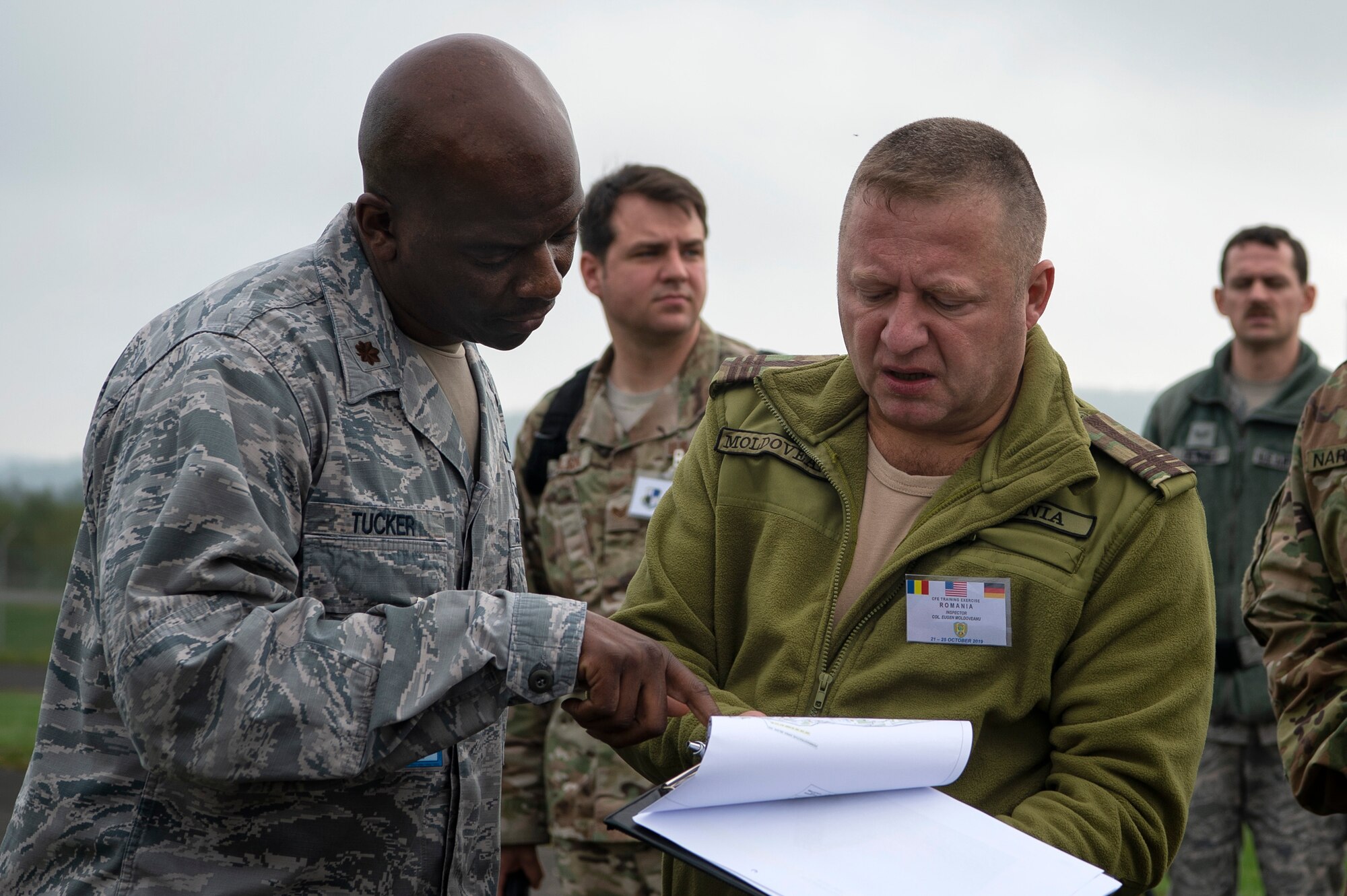 U.S. Air Force Airmen escort Romanian inspection team members during a Conventional Armed Forces in Europe Treaty exercise at Spangdahlem Air Base, Germany, Oct. 24, 2019. The CFE Treaty limits the number of battle tanks, artillery pieces, armored combat vehicles, combat aircraft, and attack helicopters each participating state party can have within the European Area of Application. The exercise was held to make sure the wing is ready for a potential real-world inspection, which can happen with as little as 43 hours' notice. (U.S. Air Force photo by Airman 1st Class Valerie Seelye)