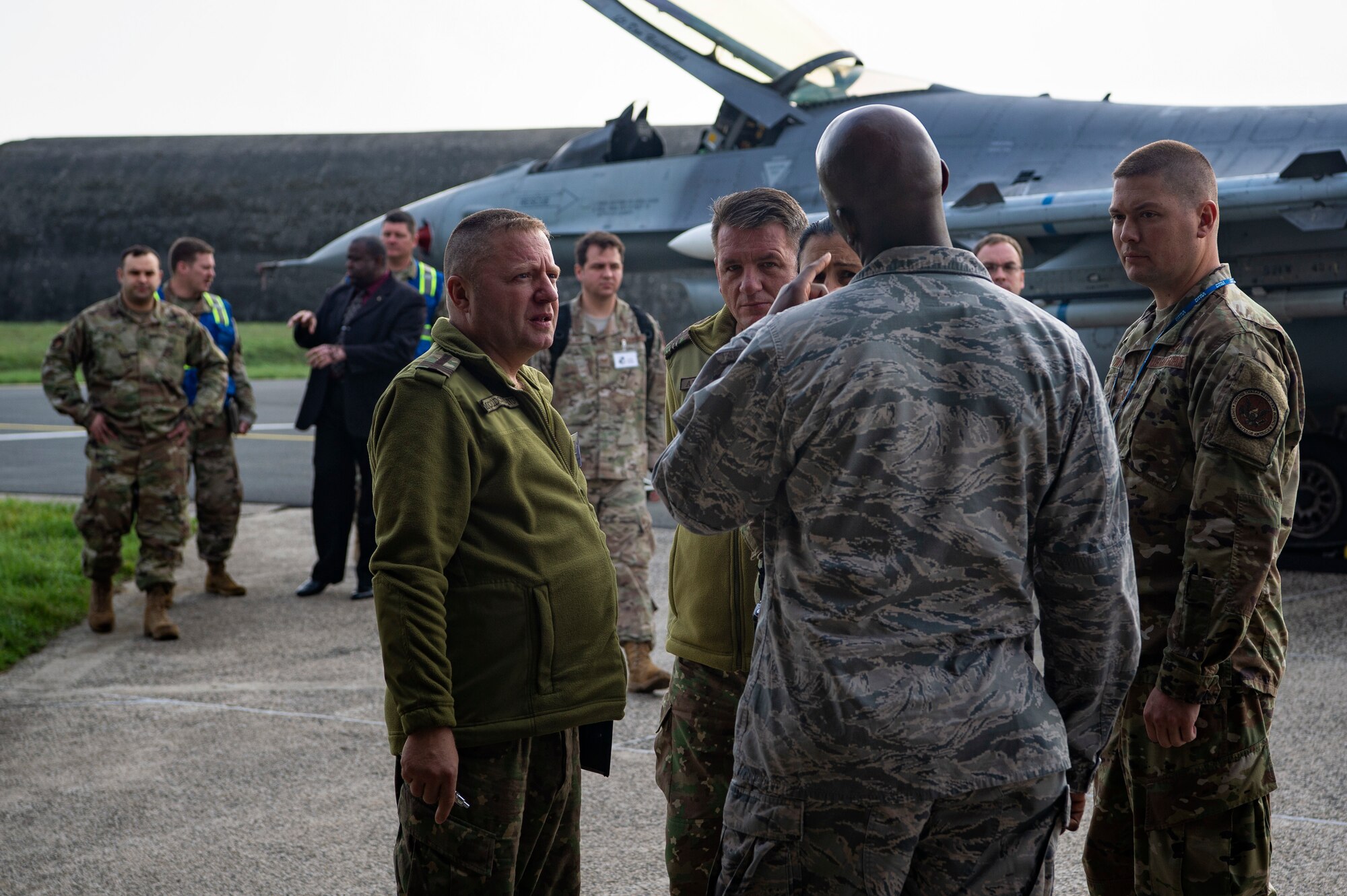 U.S. Air Force Airmen from the 52nd Fighter Wing escort Romanian inspection team members and members of the Defense Threat Reduction Agency during a Conventional Armed Forces in Europe Treaty exercise at Spangdahlem Air Base, Germany, Oct. 24, 2019. In the event of a real-world CFE inspection, the 52nd FW must account for all treaty-limited equipment, including combat aircraft in transit or equipment on cargo aircraft. (U.S. Air Force photo by Airman 1st Class Valerie Seelye)
