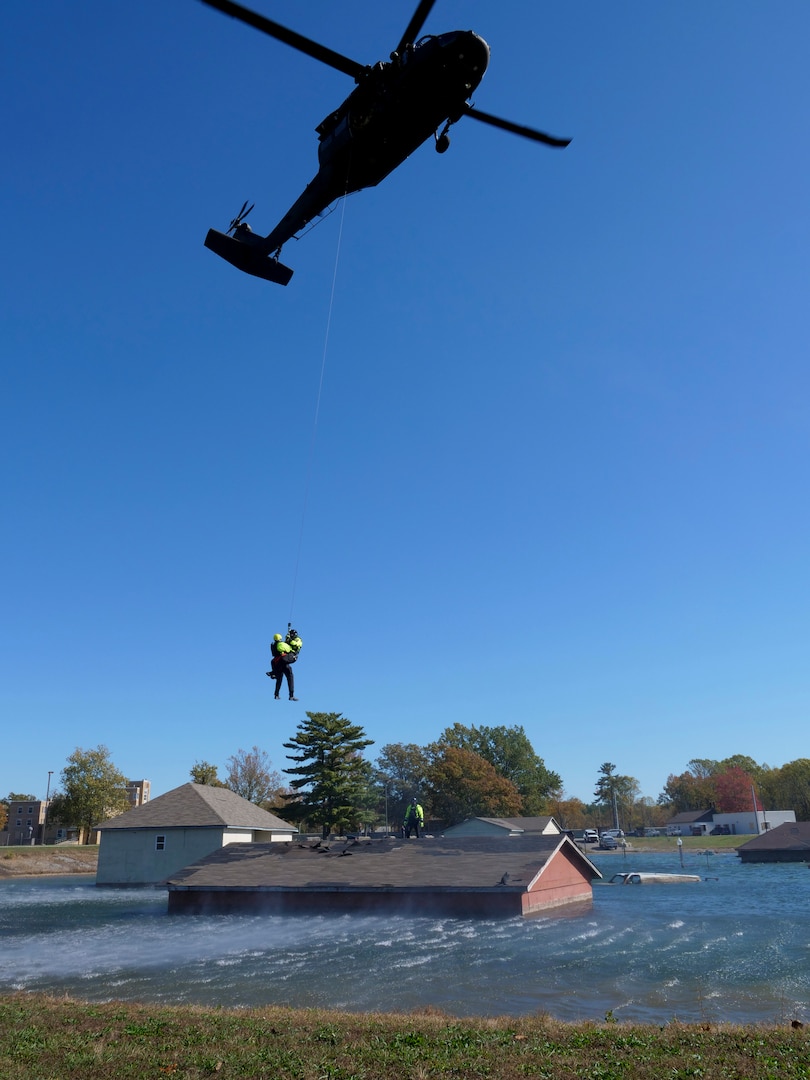 The Indiana Army National Guard Helicopter Aquatic Rescue Team and the South Bend Swift Water Rescue Team conduct hoist operations during monthly training Oct. 23-24, 2019, at the Muscatatuck Urban Training Center.