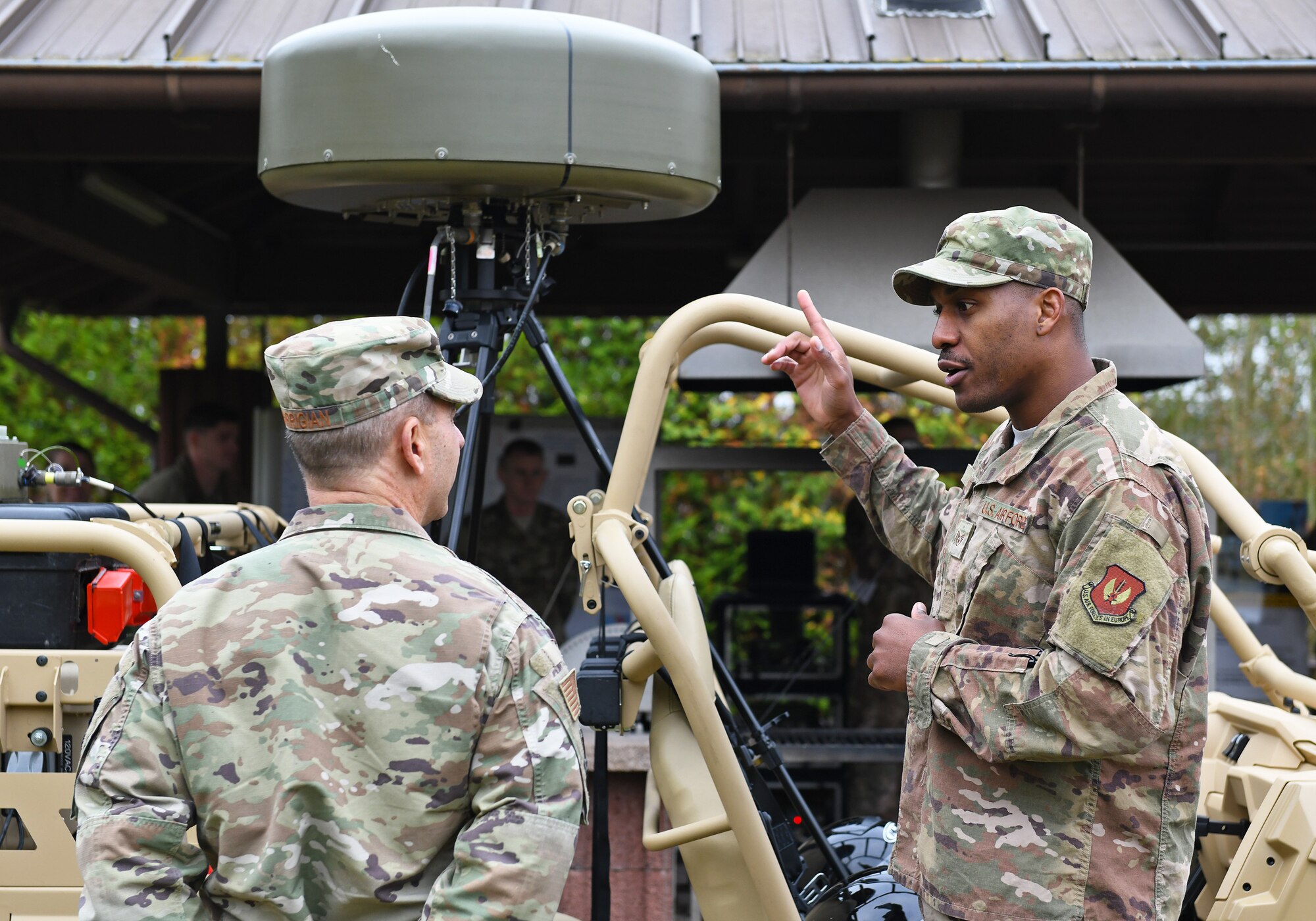 U.S. Air Force Staff Sgt. Sean Scott, right, 1st Combat Communications Squadron landing zone safety officer, briefs Gen. Jeff Harrigian, U.S. Air Forces Europe and Air Forces Africa commander, during an immersion tour at Ramstein Air Base, Germany, Oct. 23, 2019. During the tour, Harrigian learned about Airmen’s innovations and challenges as well as current operations from experts across the 435th Air Ground Operations Wing and the 435th Air Expeditionary Wing. (U.S. Air Force photo by Staff Sgt. Alex Fox Echols III)