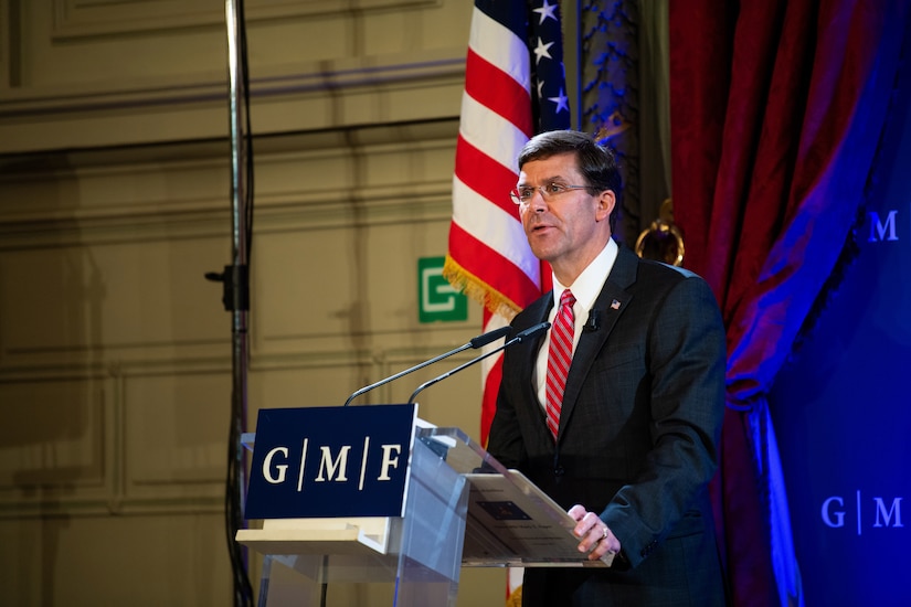 Defense Secretary Dr. Mark T. Esper speaks from behind a lectern.
