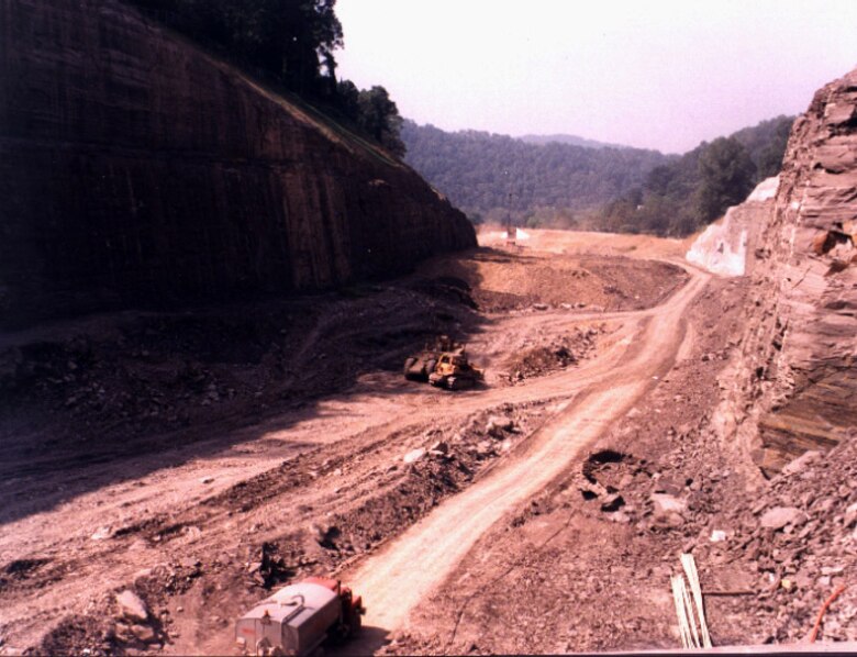 Construction crews work on the divide cut to divert the Cumberland River in Loyall, Ky., Feb. 20, 1998. The U.S. Army Corps of Engineers Nashville District construction was part of phase three of the Harlan Flood Control Project. Officials dedicated the overall completion of the project Oct. 25, 1999. (USACE Photo)