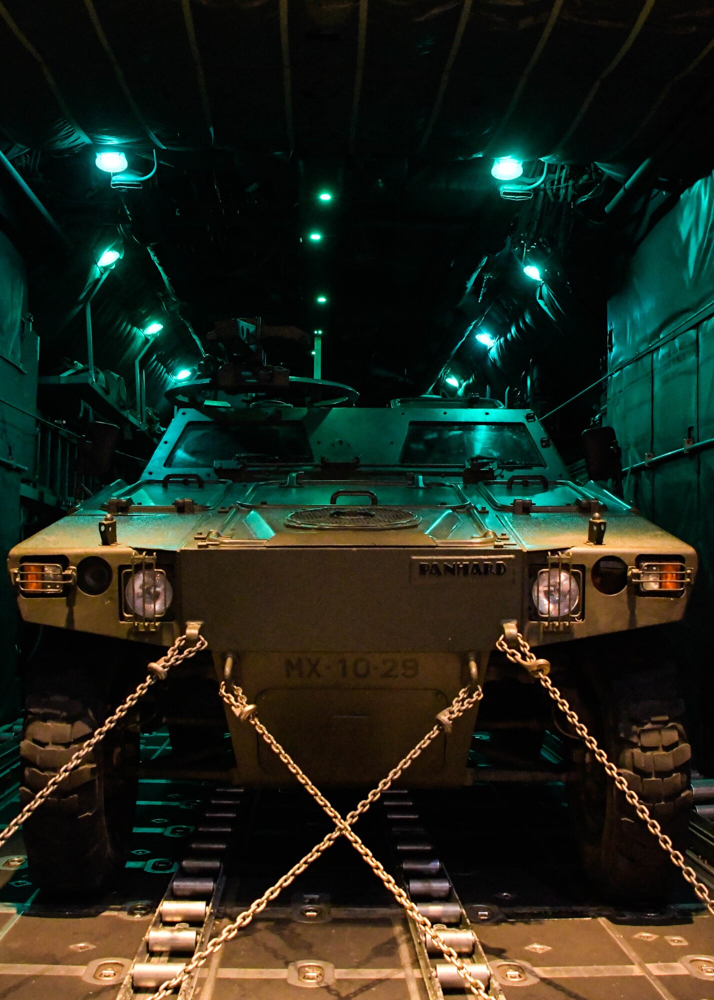 A Portuguese M-11D Light Reconnaissance Vehicle is strapped into a C-130H3 from Dobbins Air Reserve Base, Georgia, before taking off for a Night Tactical Air-Land Mission during Exercise Real Thaw 2019 at Beja Air Base, Portugal, Oct. 2, 2019. Real Thaw is a Portuguese-led large joint and combined force exercise held annually where Dobbins provided aerial support. (U.S. Air Force photo/Senior Airman Josh Kincaid)