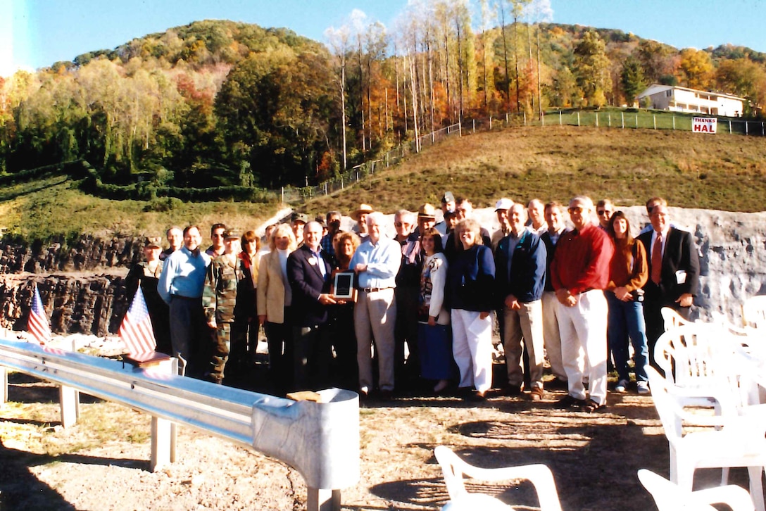 Congressman Hal Rogers, Kentucky 5th District, poses with attendees while celebrating the completion of the Harlan Flood Control Project Oct. 25, 1999 in Loyall, Ky. The decade-long project managed by the U.S. Army Corps of Engineers Nashville District provided a maximum level of flood protection to the towns of Harlan, Baxter, Loyall and Rio Vista in Harlan County, Kentucky. (USACE Photo by Bill Peoples)