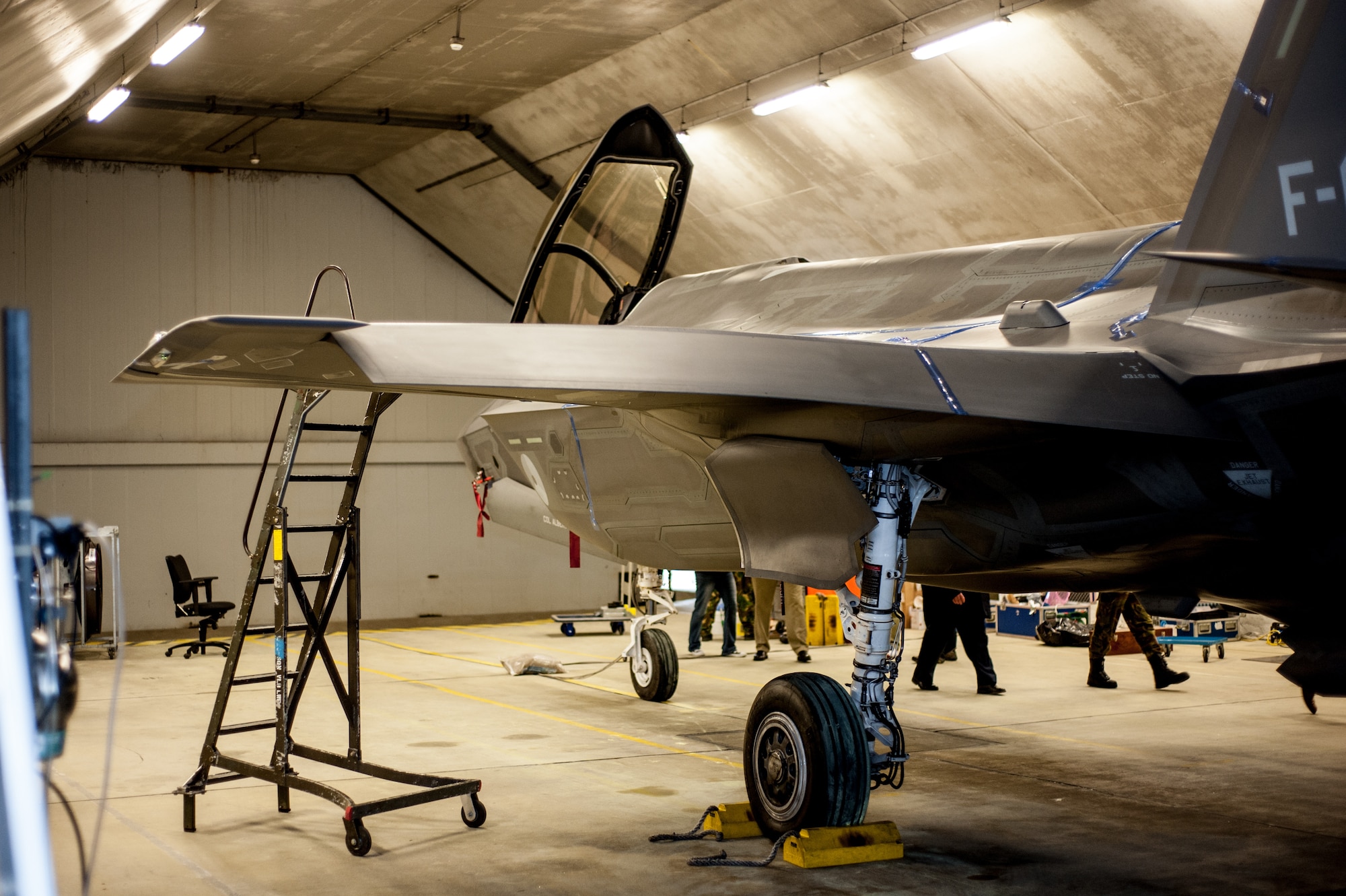 An F-35 is parked inside a hardened aircraft shelter in the Netherlands during a testing session, led by acoustics experts in the Air Force Research Laboratory’s 711th Human Performance Wing. The team gathered acoustics data for the Netherlands Royal Air Force by affixing microphones to the fighter’s skin with a blue tape-like material and epoxies to avoid damaging the surface coatings, and then running up the engine. (Photo courtesy of Royal Netherlands Air Force)