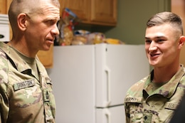 Spc. Ryan Murphy, 1st Theater Sustainment Command, answers question given by Sgt. Major of the Army Micheal A. Grinston, during his visit to Fort Knox, Ky.