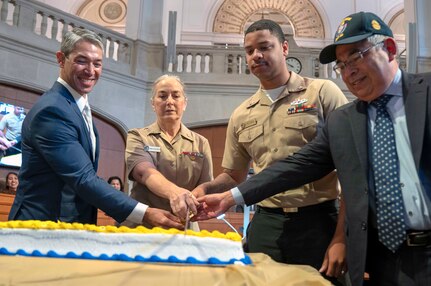 (From left) San Antonio Mayor Ron Nirenberg; Capt. Elizabeth Montcalm-Smith, Navy Medicine Education, Training and Logistics Command acting deputy commander; Petty Officer 2nd Class Lebron Freeman, assigned to Navy Medicine Training Support Center; and Navy Veteran Any Segovia, San Antonio city attorney, cut the 244th Navy birthday cake during a city hall meeting. The city recognition included the Navy birthday cake cutting, singing “Anchors Aweigh” and honoring Navy active, Reserve and veterans attending.