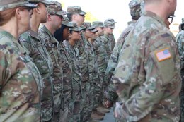 Soldiers of the 1st Theater Sustainment Command stand at parade rest outside the unit's barracks following a walk through conducted by Sgt. Major of the Army Micheal A. Grinston Oct. 24, 2019, at Fort Knox, Ky.