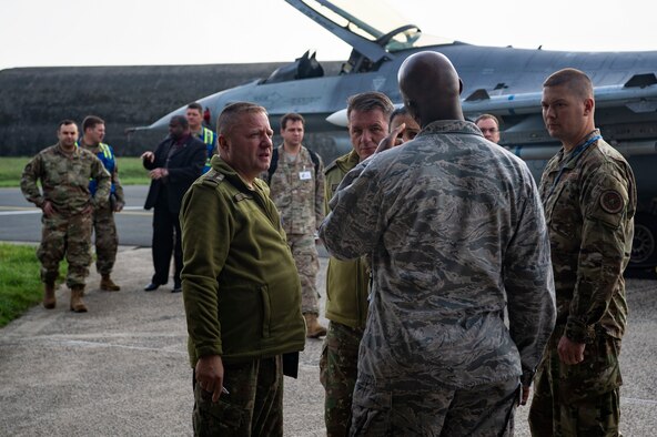 U.S. Air Force Airmen from the 52nd Fighter Wing escort Romanian inspection team members and members of the Defense Threat Reduction Agency during a Conventional Armed Forces in Europe Treaty exercise at Spangdahlem Air Base, Germany, Oct. 24, 2019. The exercise took place to verify readiness of the 52nd FW in the event of a short-notice CFE inspection. Inspectors must be granted access to any facility on the installation with an entryway measuring two meters or more in width, to include containers that measure two meters or more along all dimensions. (U.S. Air Force photo by Airman 1st Class Valerie Seelye)