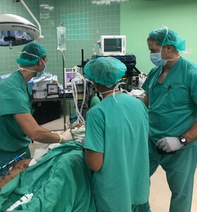 (From Left) Army Capt. Trey Baker, Army Capt. Eric Wang, and Army Col. Aaron Elliott perform a regional anesthesia block on a patient Sept. 19 during a Medical Readiness Exercise in Tegucigalpa, Honduras. A team of 19 military medical personnel from Brooke Army Medical Center and other military treatment facilities completed 128 procedures from Sept. 14-27.