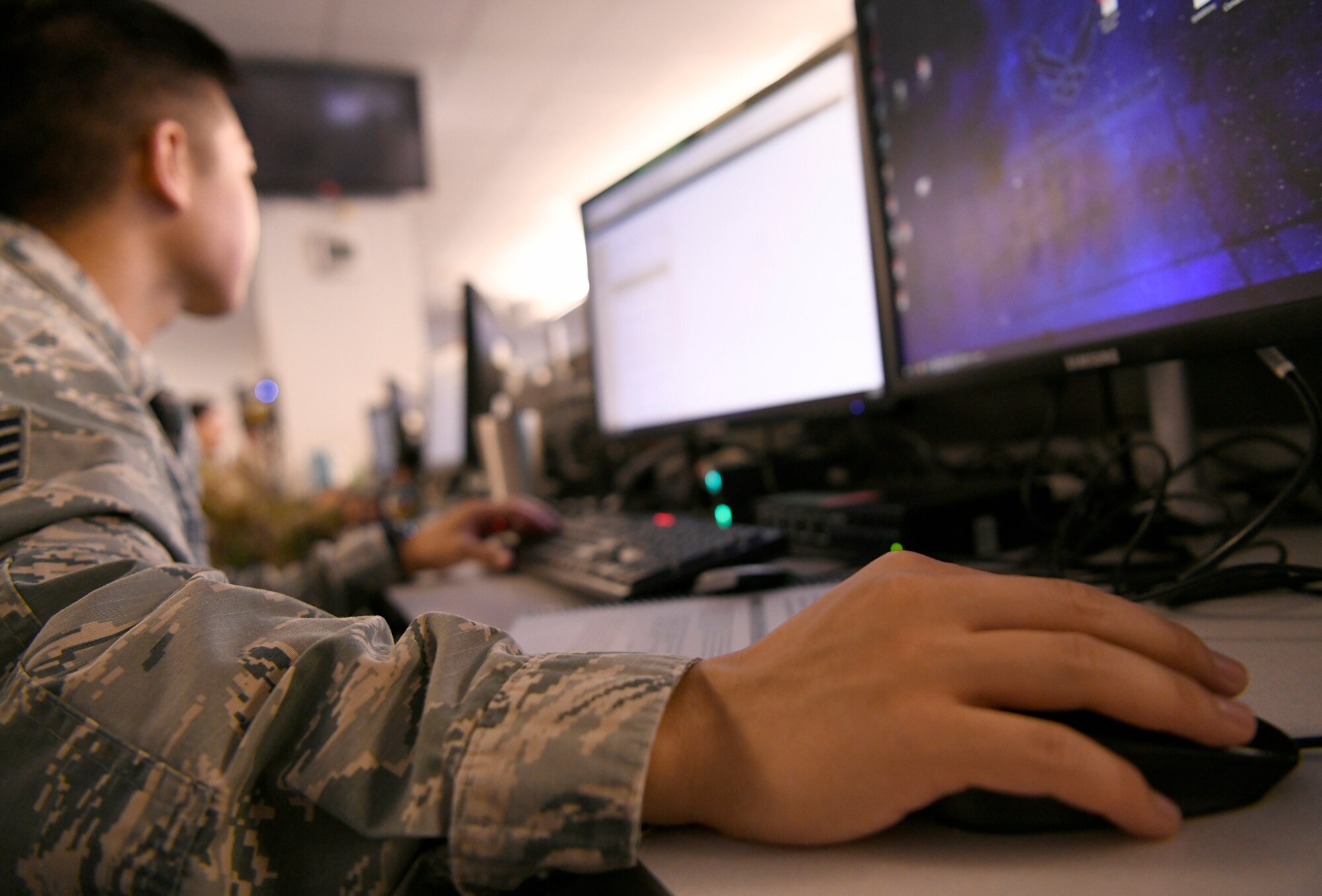 A U.S. Air Force Airman from the 33rd Network Warfare Squadron, conducts cyber operations at Joint Base San Antonio-Lackland, Texas, Aug. 27, 2019. Airmen from the 33rd NWS utilize a cyber weapon system that employs more than 40 tools and applications. The “12N12” initiative aims to reduce this number to 12 in 12 months. (U.S. Air Force photo by Tech. Sgt. R.J. Biermann)