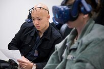 Derrick Ng, NASA aerospace engineer intern, monitors the virtual reality flight sortie of 1st Lt. April Albanese, Pilot Training Next student, as part of collaborative research agreement between Air Education and Training Command and NASA Oct. 22 at Joint Base San Antonio-Randolph. The goal of the agreement is to help both AETC and NASA collect physiological and cognitive data and leverage each organization's knowledge and skills to maximize learning potential for individual students.