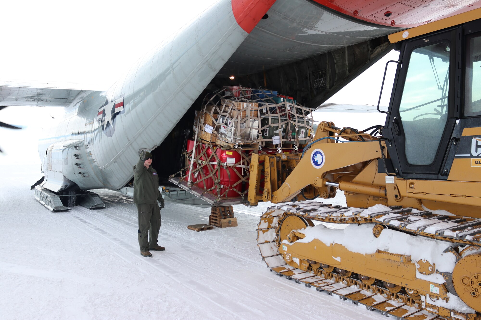 U.S. Air Force Airmen, assigned to the 109th Airlift Wing, New York Air National Guard, load cargo onto an LC-130 “Skibird”, a ski equipped aircraft, at McMurdo Station, Antarctica, Dec. 28, 2018. The 109th AW provided aviation support to U.S. Antarctic research mission from October 2018 to February 2019 as part of Operation Deep Freeze, the U.S. military support to the National Science Foundation. (U.S. Air National Guard photo by Tech Sgt. Gabriel Enders)
