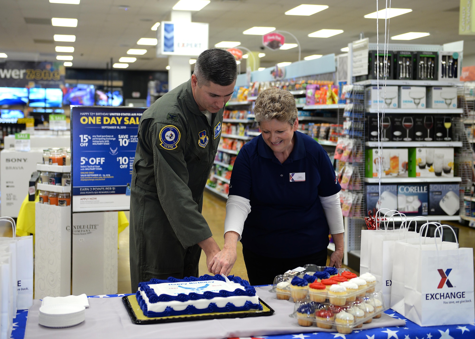 Col. David Fazenbaker, 14th Flying Training Wing vice commander, and Hazel, Base Exchange store manager, cut the cake during the Air Force’s 72nd Birthday cake cutting at the BX Sept. 18, 2019, on Columbus Air Force Base, Miss. The U.S. Air Force was established after the conclusion of World War II with the passing of the National Security Act of 1947, signed on July 26, 1947 by former President Harry S. Truman. (U.S. Air Force photo by Airman 1st Class Hannah Bean)