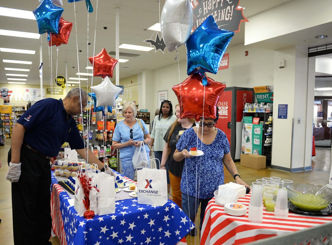 Attendees grab slices of cake and punch during the Air Force’s 72nd Birthday at the Base Exchange Sept. 18, 2019, on Columbus Air Force Base, Miss. With the signing of the National Security Act, the Air Force was officially established on Sept. 18, 1947. (U.S. Air Force photo by Airman 1st Class Hannah Bean)