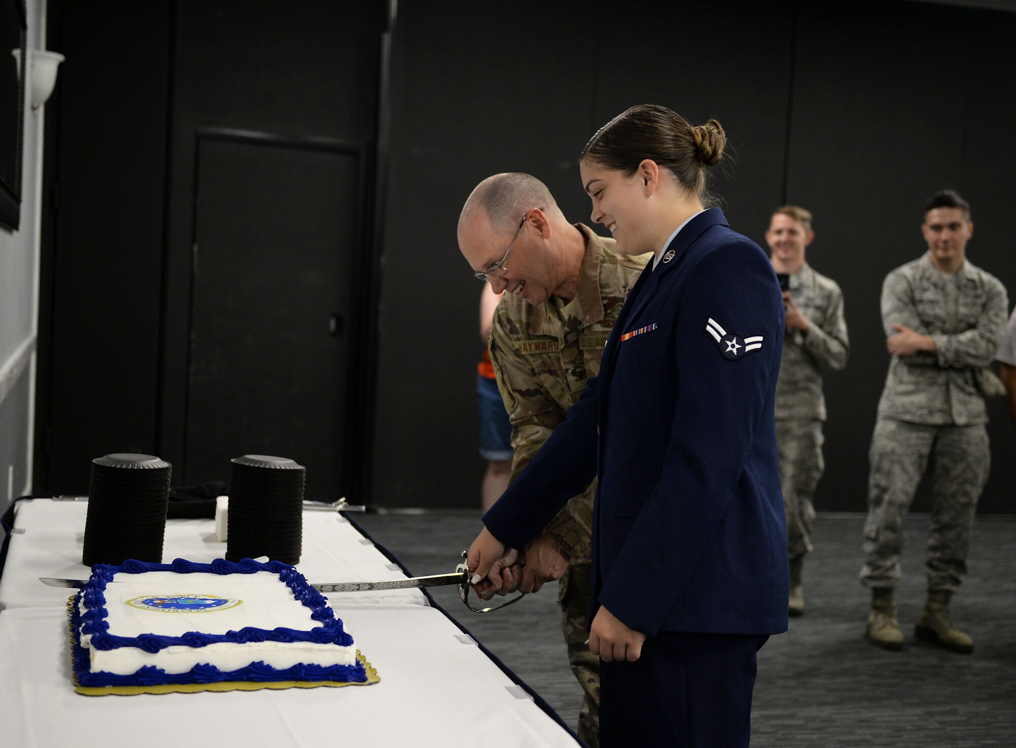 Col. Gary Hayward, 14th Mission Support Group commander, and Airman 1st Class Savannah Hebert, 14th Operations Support Squadron, cut the cake during the Air Force’s 72nd Birthday cake cutting at the Columbus Club Sept. 18, 2019, on Columbus Air Force Base, Miss. The Air Force is the youngest of the four military branches within the Department of Defense. (U.S. Air Force photo by Airman 1st Class Hannah Bean)