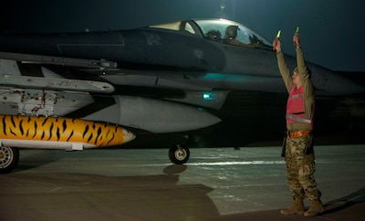 Airman 1st Class Blake Bullock, a crew chief from the 20th Aircraft Maintenance Squadron at Shaw Air Force Base, S.C., marshals F-16 Fighting Falcons upon their arrival at Bagram Airfield, Afghanistan, Oct. 25, 2019. While assigned to the 455th Air Expeditionary Wing at Bagram, the F-16s will help provide decisive airpower through the U.S. Central Command area of responsibility. The airpower the wing provides ensures NATO forces can focus on their mission to train, advise and assist.(U.S. Air Force photo by 2nd Lt. Brigitte N. Brantley)