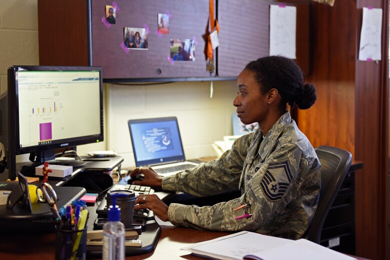 U.S. Air Force Senior Master Sgt. Angel McKenzie, 17th Communications Squadron flight chief of operations, works in her office at Goodfellow Air Force Base, Texas, Oct. 23, 2019. McKenzie assisted with the National Disability Employment Awareness Month information fair due to her personal connection since she was diagnosed with multiple sclerosis in 2003. (U.S. Air Force photo by Airman 1st Class Zachary Chapman/Released)