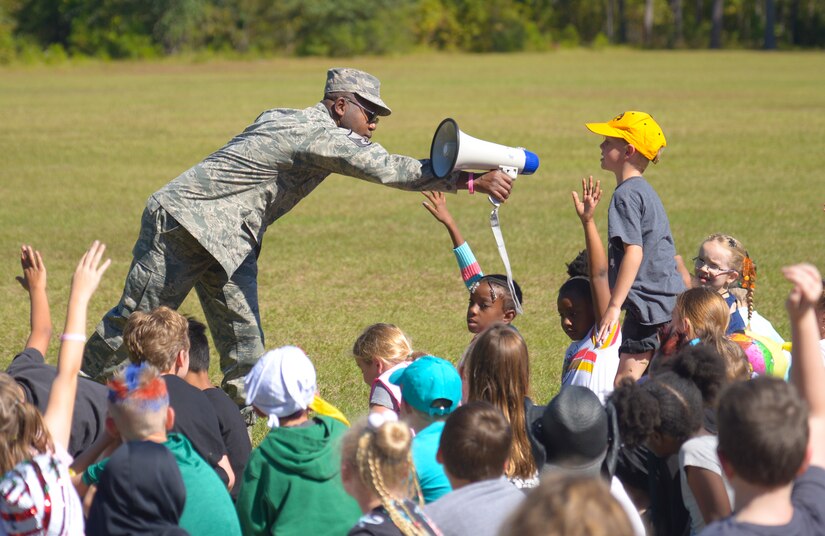 Master Sgt. Maurice Ferguson, a drug demand and reduction program manager assigned to the 315th Aerospace Medical Squadron, leans in to let a student speak into the megaphone, October 23, 2019, at Marrington Elementary School on Joint Base Charleston, S.C. Ferguson was at the school to talk to the children about drug prevention during Red Ribbon Week. Red Ribbon Week, which takes place October 23-31, is an awareness program that began in 1985 as a way to show opposition to drugs as stated by the Get Smart About Drugs foundation.