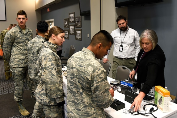 Students interact with displays during the National Disability Employment Awareness Month information fair at the event center, Goodfellow Air Force Base, Texas, Oct. 21, 2019. Booths were set up by the Airman and Family Readiness Center, Texas Workforce Solutions – Vocational Rehabilitation, San Antonio Lighthouse for the Blind, and a representative from the U.S. Department of Veterans Affairs. (U.S. Air Force photo by Airman 1st Class Zachary Chapman/Released)