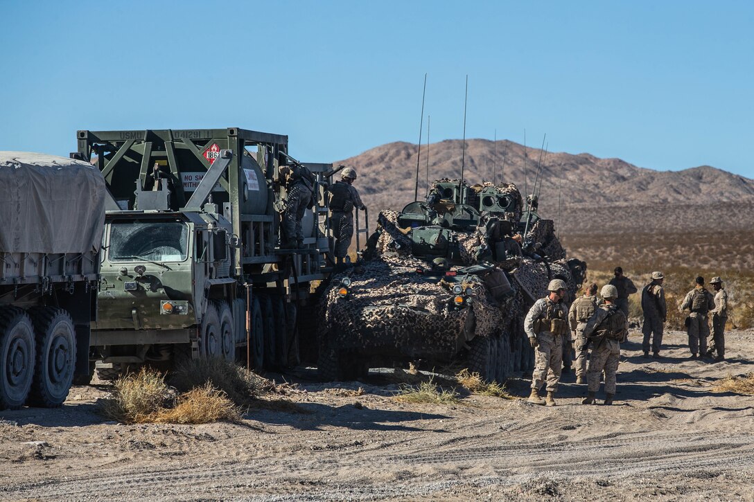 U.S. Marines with Combat Logistics Battalion 8, Combat Logistics Regiment 2, 2nd Marine Logistics Group, refuel Marines with 2nd Light Armored Reconnaissance Battalion at a rapid resupply point during Integrated Training Exercise 1-20 at Marine Corps Air Ground Combat Center Twentynine Palms, Calif., Oct. 22, 2019. CLB-8 integrated with 2nd Marine Regiment during ITX as the logistics combat element to provided tactical logistics in the areas of medium and heavy-lift motor transportation beyond the regiment’s organic capabilities. (U.S. Marine Corps photo by Cpl. Scott Jenkins)