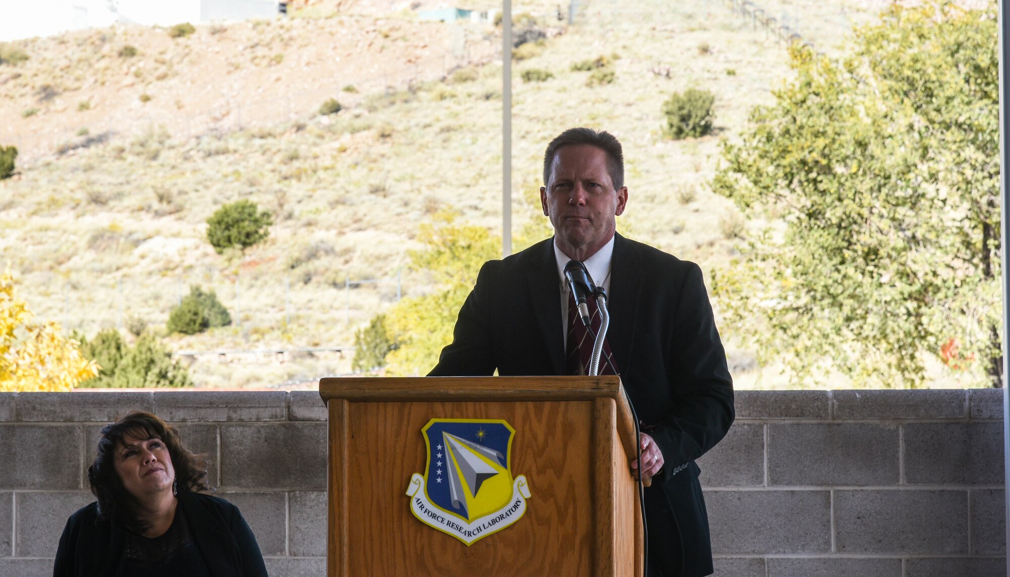 Dr. Kelly D. Hammett, Air Force Research Laboratory Directed Energy Directorate director, gives a speech at the building dedication ceremony held at Kirtland Air Force Base, N.M., Oct. 18, 2019. Hammett and other friends and colleagues gave tribute to the late Terry S. Duncan, who the building was dedicated to. (U.S. Air Force photo by Airman First Class Ireland Summers)