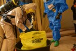 Army Staff Sgt. Matthew Kauffman works to decontaminate items during the Pennsylvania National Guard’s 3rd Weapons of Mass Destruction Civil Support Team evaluation exercise Oct. 25 at Steam Town National Historic Park, Scranton, Pa.