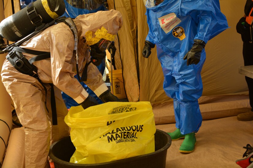 Army Staff Sgt. Matthew Kauffman works to decontaminate items during the Pennsylvania National Guard’s 3rd Weapons of Mass Destruction Civil Support Team evaluation exercise Oct. 25 at Steam Town National Historic Park, Scranton, Pa.