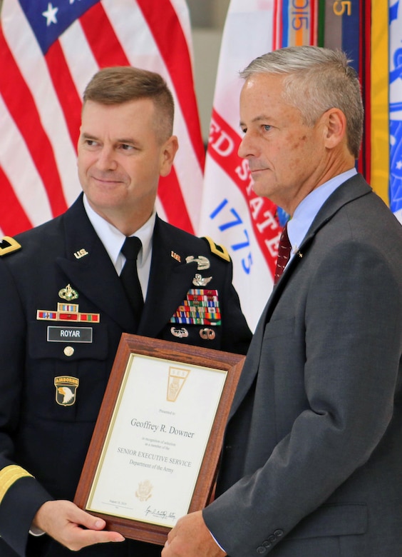 Maj. Gen. Todd Royar, commanding general of the of the U.S. Army Aviation and Missile Command, presents a Certificate of Senior Executive Service to Geoff Downer, director of the AMCOM’s Special Programs (Aviation), during a SES appointment ceremony Oct. 18 at Joint Base Langley-Eustis, Virginia.
