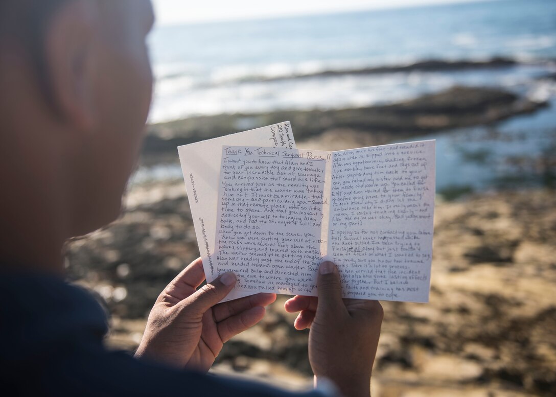 Staff Sgt. Christopher Parise, 576th Flight Test Squadron missile handling evaluator, reads a letter near Wall Beach Oct. 24, 2019, at Vandenberg Air Force Base, Calif. Carla Freeman wrote Parise the letter to thank him for saving the life of her husband Al Freeman, a Vietnam veteran. In the letter, Carla explained that Al has Parkinson’s disease and had been feeling depressed lately. She was uncertain as to why Al chose to go out in the ocean that evening, but if it wasn’t for Parise, she would have lost the love of her life, and for that, she expressed her full gratitude. (U.S. Air Force photo by Airman 1st Class Aubree Milks)