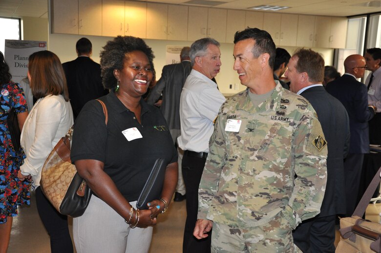 Business representative Robin Thorne discusses potential opportunities with U.S. Army Corps of Engineers Los Angeles District Commander Col. Aaron Barta at the annual Business Opportunities Open House Oct. 9 in the District's downtown LA headquarters.