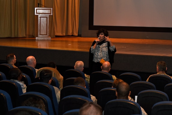 U.S. Air Force Capt. Lance Sijan’s sister, Janine Sijan, speaks to a crowd before sharing her movie ‘Sijan’ at the base theater, Oct. 25, 2019. Her movie provides a more personal look into the life of Lance who posthumously received the Medal of Honor on March 4, 1976. (U.S. Air Force photo by Airman 1st Class Zachary Chapman/Released)